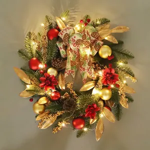 Christmas wreath with LED lights, red and gold ornaments, pine cones and a festive bow