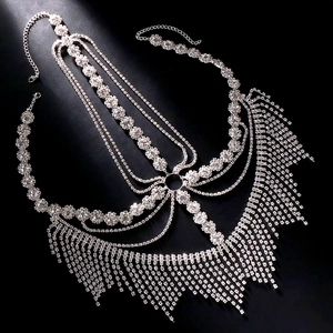 Detailed macro view of silver floral crystal mask with long rhinestone fringes