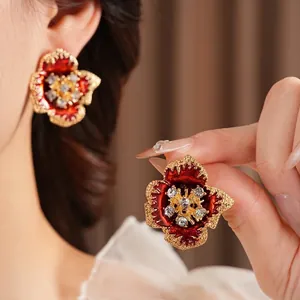 Vintage gold floral enamel earrings with red petals and crystal center for women