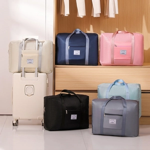 Foldable large capacity travel bags in various colors with luggage trolley sleeve