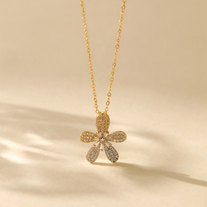 Detail view of 18K gold plated flower pendant with sparkling cubic zirconia inlay