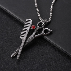 Silver scissor and comb necklace with red rhinestone pendant in stainless steel