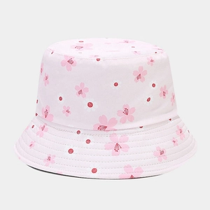 Close-up of pink cherry blossom pattern and stitching details on the cotton sun hat