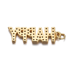 Detailed macro shot of a gold-plated HAPPY letter pendant with black zircon stone inlays