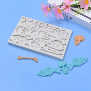 Halloween silicone mold featuring skull, bat wings and bones for DIY cake baking and crafts