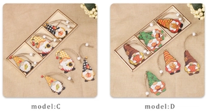 Detail of wooden gnome ornaments with sunflower and pumpkin motifs for harvest decor