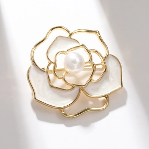 Elegant hollow camellia flower brooch with white enamel petals and central pearl inlay