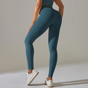 Detail view of seamless dark blue high waisted yoga leggings with butt-lifting stitching