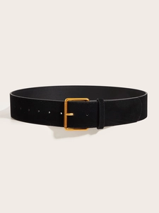 Detail of vintage matte black suede waist belt featuring a classic square gold metal buckle