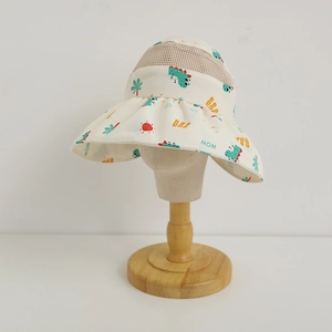 Detail of kids sun hat with cartoon dinosaur prints and breathable mesh top section
