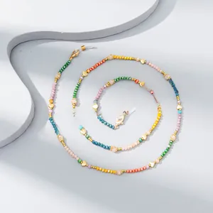 Detail of colorful crystal beaded eyeglass chain with gold heart beads and silicone loops