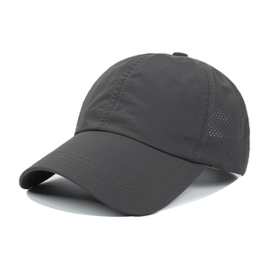 Detail view of the breathable mesh holes and quick-dry fabric on this dark grey baseball cap