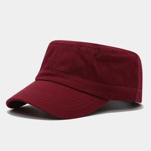 Detail view of burgundy cotton twill fabric and stitching on a flat top cadet hat