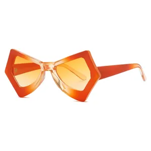 Stylish butterfly shaped sunglasses with orange gradient lenses and translucent frames