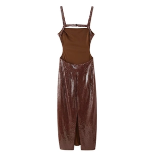 Detail of sequined brown backless maxi dress with side slit and cutout accents