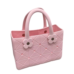 Pink EVA beach tote bag with geometric diamond texture and floral decorative buttons