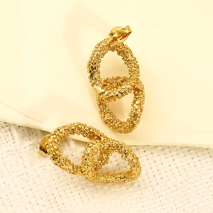 Gold plated stainless steel double oval stud earrings with textured grainy surface finish