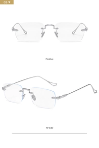 Macro detail of silver rimless rectangular glasses with engraved metal temples in Y2K style
