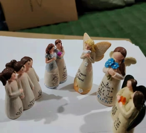 Detail of friendship resin angel figurines with Forever my friend and Sister inscriptions
