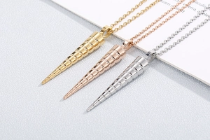 Detail of cone spiral pendants in gold, rose gold, and silver stainless steel finishes