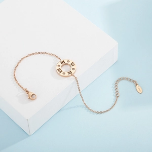 Rose gold stainless steel bracelet with Roman numerals pendant on white geometric background