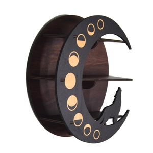 Macro detail of Boho wooden crystal shelf featuring carved moon phases and a wolf silhouette
