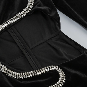 Close-up of velvet fabric with silver marquise rhinestones and invisible zipper detail