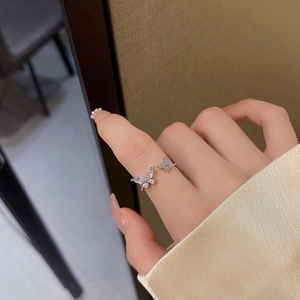 Elegant silver open butterfly ring with pear-cut cubic zirconia and pavé stones