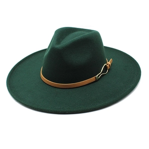 Detail of dark green wide-brim wool fedora with brown leather band and gold buckle