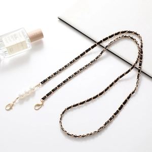 Black leather and gold chain crossbody phone strap with elegant white pearl accents