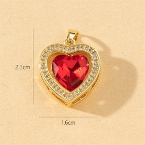 Gold plated heart pendant with red zircon and crystal accents measuring 2.3cm by 1.6cm