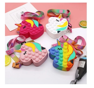 Selection of four unicorn pop-it silicone bags with rainbow straps for kids and toddlers