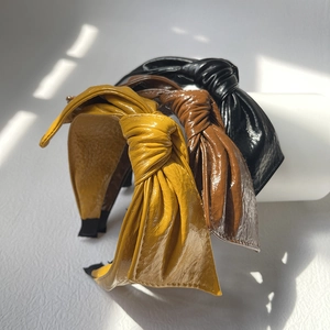 Vintage PU leather headband set with twisted bow design in black, brown and yellow colors