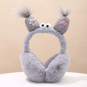 Detail of plush grey earmuffs with cartoon eyes, braided antennae and pink stars