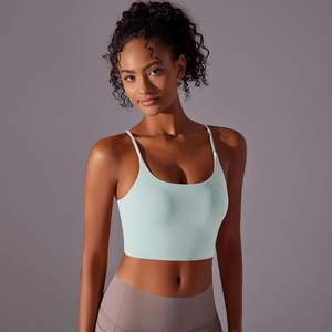 Detailed shot of thin-strap yoga bra in light mint green with seamless U-neck design