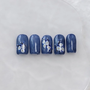Deep blue marble nail stickers with white camellia floral pattern for elegant manicure