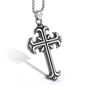 Engraved cross pendant in vintage silver stainless steel on a white background