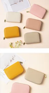 Detail of RFID leather card holders with lychee texture and gold zippers in various colors