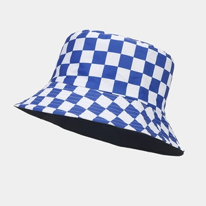 Detailed view of the blue and white checkered bucket hat with a black reversible inner lining