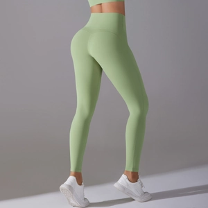 Side view of avocado green high-waisted yoga leggings showing bum lift and seamless design
