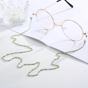Silver eyewear chain with neon yellow beads and adjustable silicone anti-slip ends