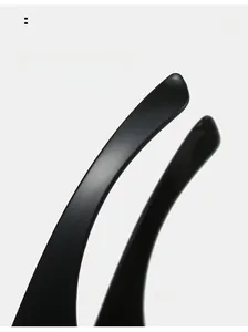 Macro detail of matte black curved temple arms on rimless Y2K cycling sunglasses