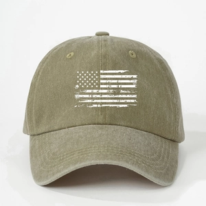Detail of olive green washed baseball cap featuring a distressed white American flag print