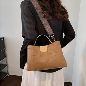 Light brown quilted PU leather tote bag with colorful ethnic patterned wide shoulder strap