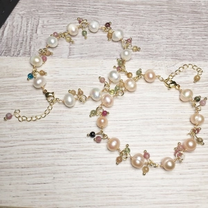 Freshwater pearl bracelet with colorful tourmaline and gold lobster clasp on wood