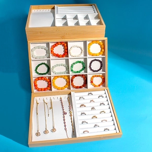 Multi-tier bamboo jewelry display tray with white lining for rings and necklaces