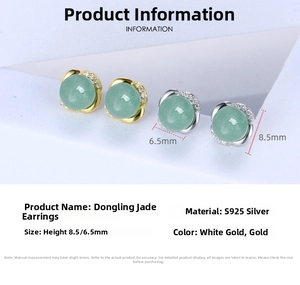 Macro shot of S925 silver Dongling jade earrings with zircon accents and gold finish