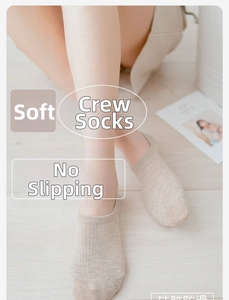 Detailed view of beige low-cut cotton socks with non-slip silicone grip for women