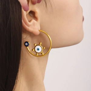 Fashionable 18K gold plated evil eye hoop earrings on female model for chic look