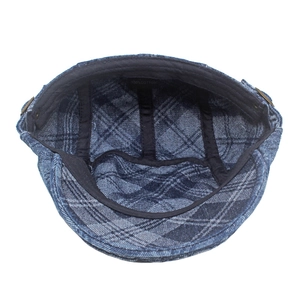 Inside view of men's blue washed denim newsboy cap featuring diamond jacquard cotton lining